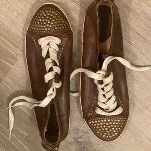 Frye company leather shoes with metal studs.